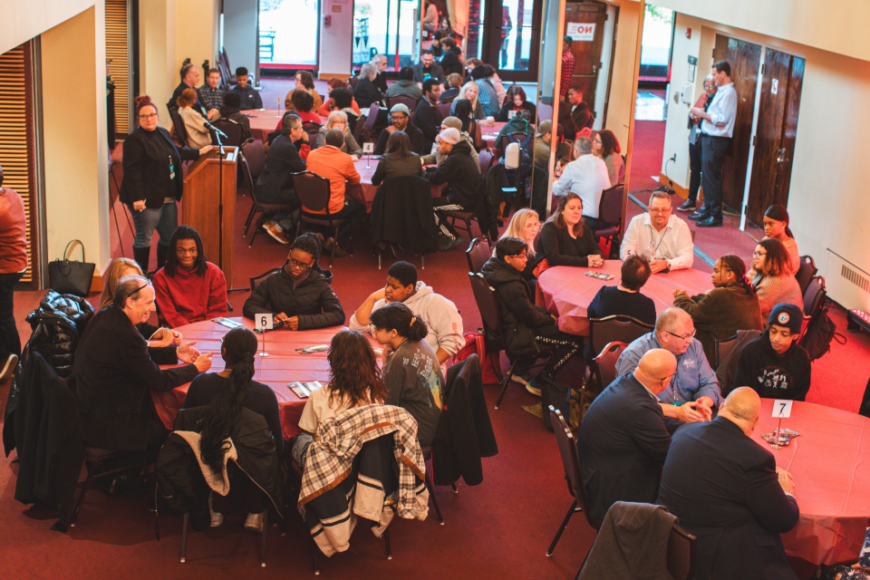 overhead photo of college students and namm members networking